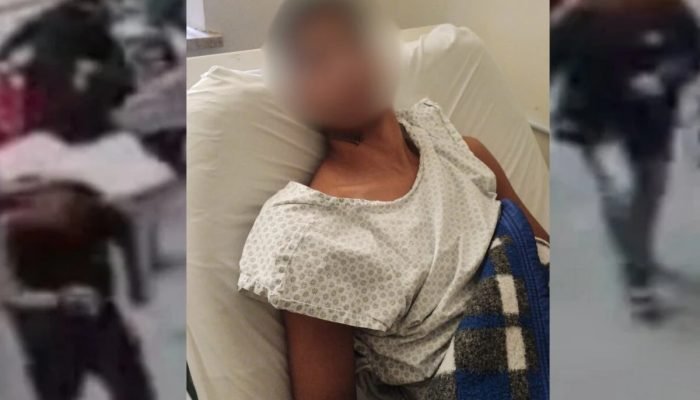 1 de 1 Homem pardo, com a face embaçada, sentado em maca hospitalar, com camisola de paciente - ...